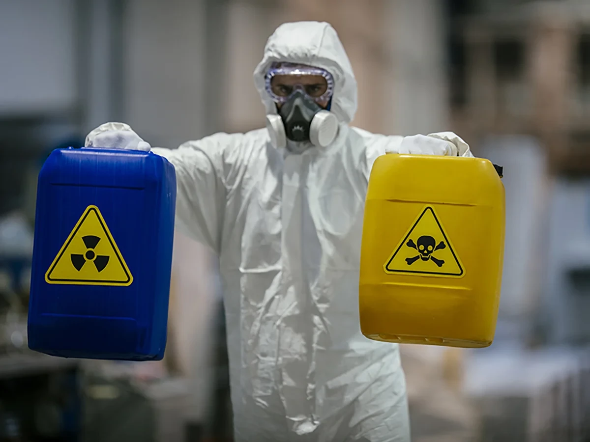 Biohazard cleanup technicians in protective equipment at a remediation scene in Wisconsin Rapids, WI